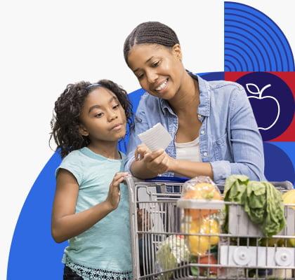 A woman and child look at a shopping list while buying produce.