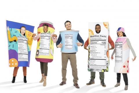 Men and women dressed in New FDA Nutritional label costumes