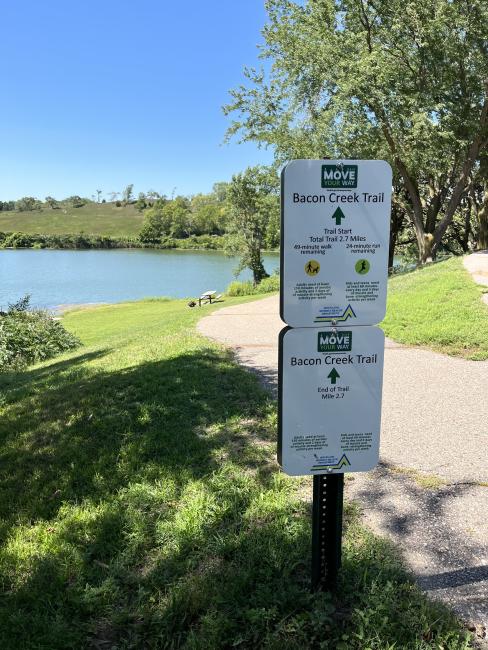 A Move Your Way sign encouraging physical activity near a trail in Sioux City, Iowa.